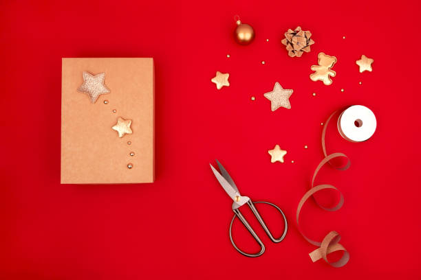 istock Craft box Christmas wrapping gift red background 1286588905