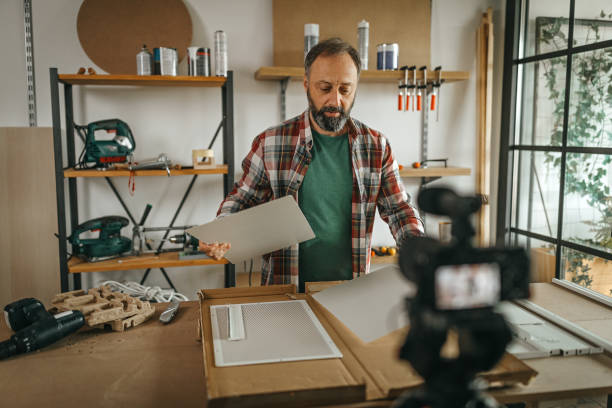 istock Mature man recording video for his vlog at home 1286589719