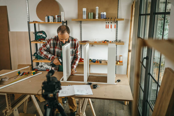istock Mature man vlogging about how to make shelf by your own 1286589722