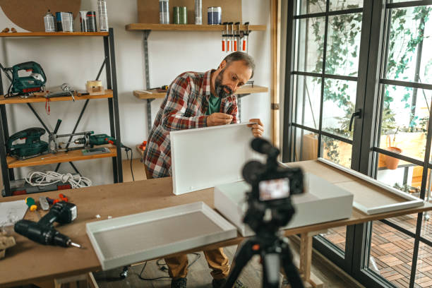 istock Mature man vlogging about how to make shelf by your own 1286589742