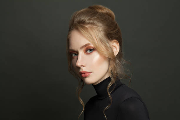 istock Elegant perfect woman face on black background 1286590585