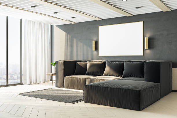 istock Living room with black sofa and blank poster on wall. 1286592754