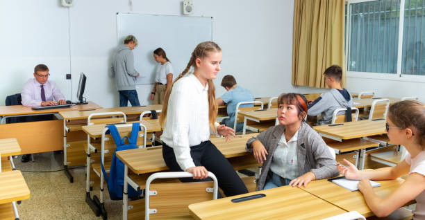istock Teenage students talking during recess between lessons 1286594737