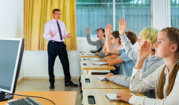 istock Side view of student group working on lecture in classroom 1286594739