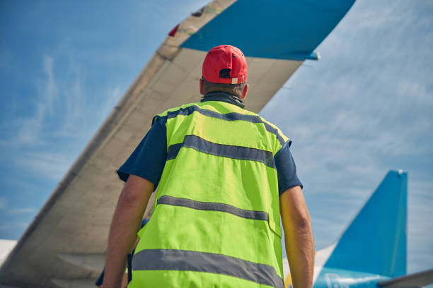 istock Man performing a visual inspection of an air vehicle 1286597590