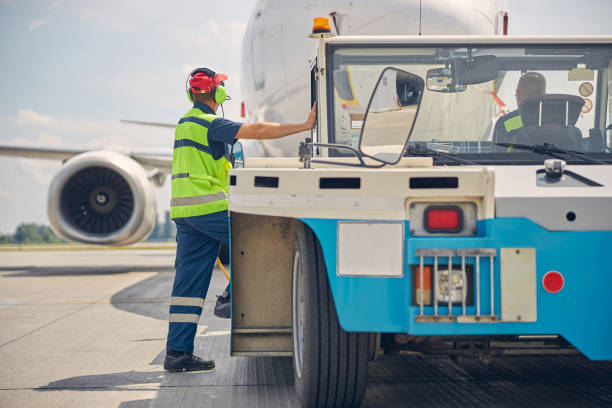 istock Man in headphones and a tug driver 1286597596