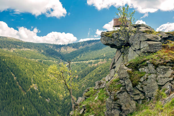 Rocky cliff with a viewing platform Rocky cliff with an observation deck on the mountains czech republic mountains stock pictures, royalty-free photos & images