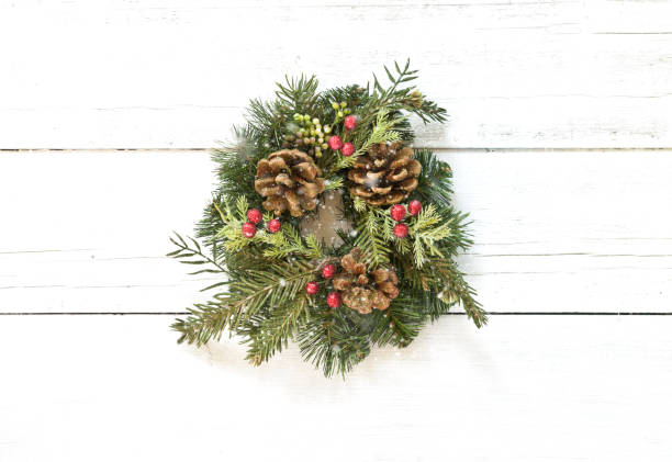 istock Christmas wreath on an old wood background 1286601572