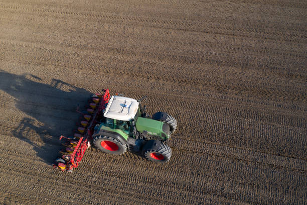 istock Tractor drilling seed, aerial view 1286602634