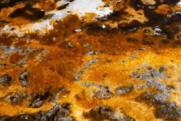 istock Creative abstract background shimmering golden yellow red swirls glowing like fire 1286603240