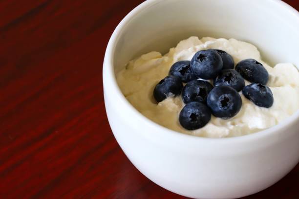 istock Natural Greek Style Yogurt With Fresh Blueberry Topping 1286603610