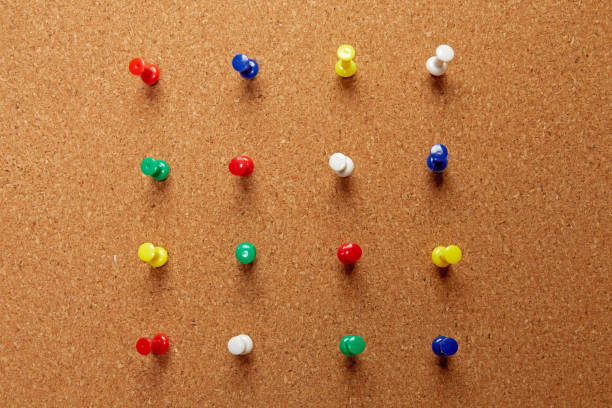 istock Group of thumbtacks pinned on corkboard 1286606807