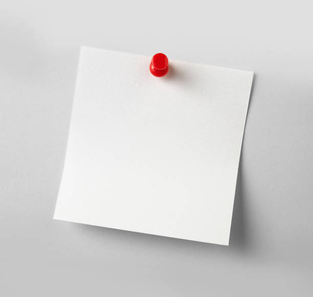 istock close up of a note paper with a red push pin on white background 1286606958