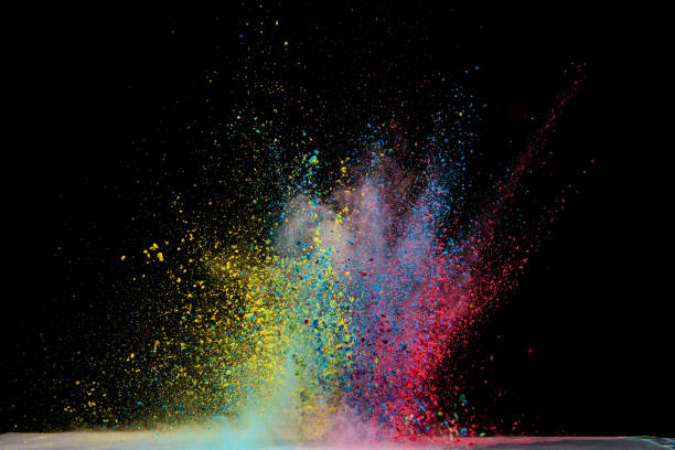 istock Explosion of colored powder isolated on black background. Abstract colored background 1286607739