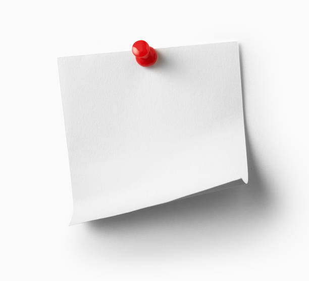 istock close up of a note paper with a red push pin on white background 1286608504