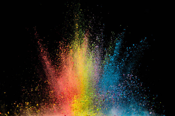 istock Explosion of colored powder isolated on black background. Abstract colored background 1286609318