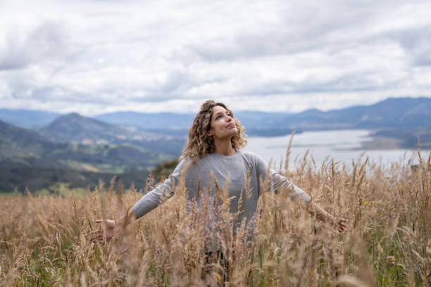 istock Happy woman relaxing outdoors in the countryside 1286610207