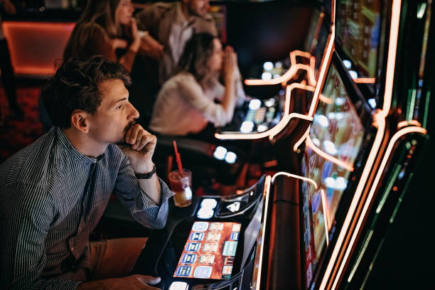 istock Friends gambling in casino 1286613702