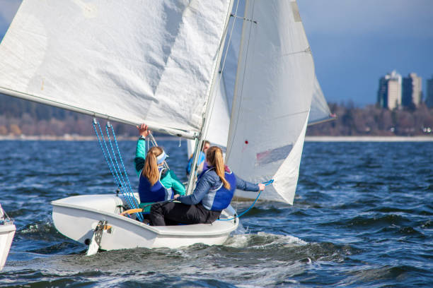 man practice sailing on laser boat in the lake