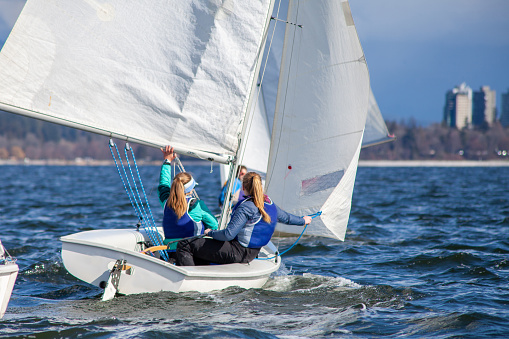 A collegiate women's sailing team competes in a regatta in Vancouver, British-Columbia with other Universities sailing the FJ Class