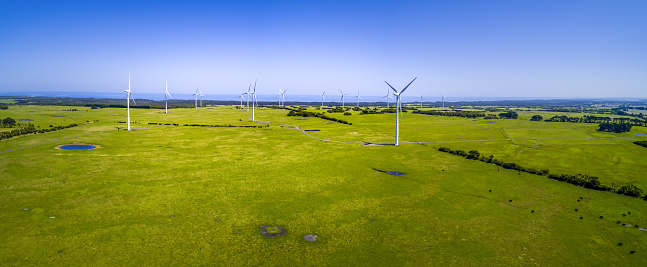 Wind farm and pastures in Australian countryside - aerial panorama