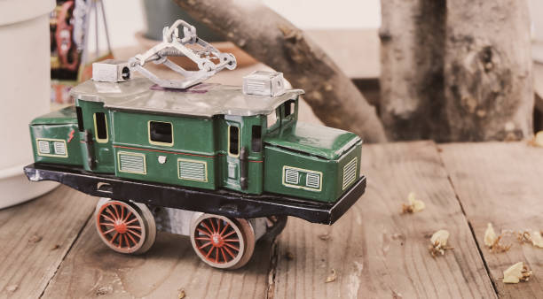 istock Old tinned toy car vintage style on wooden table 1286616221