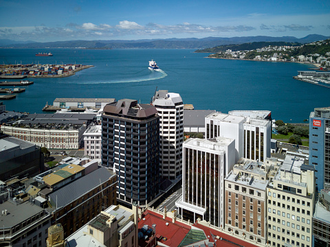 Wellington, New Zealand - 20 November, 2020: The Bluebridge ferry leaving dock in Wellington Harbour, New Zealand.