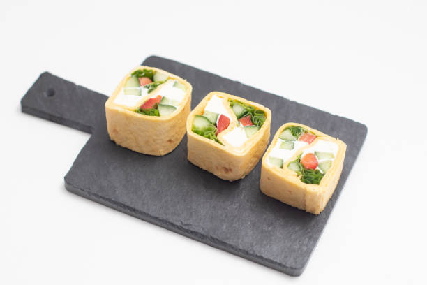 istock Set of Tortilla roll with vegetables served on a black slate board 1286616544
