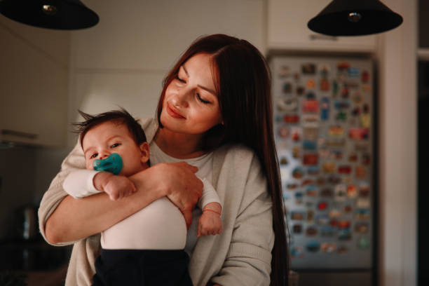 istock Mom carrying her smiling baby boy 1286617517
