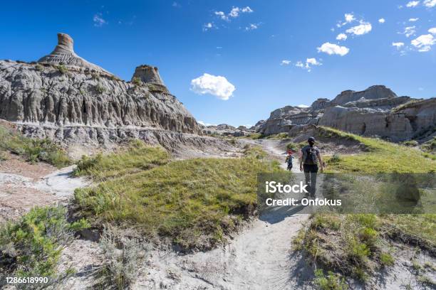Mother And Son Hiking In Badlands Of Dinosaur Provincial Park In Alberta Canada Stock Photo - Download Image Now