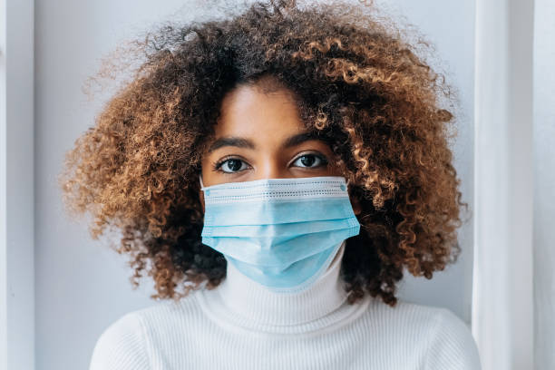 istock Pretty model with big brown eyes wearing protective mask 1286619268