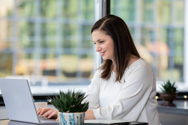 istock Confident businesswoman is financial advisor working with technology in office 1286620078