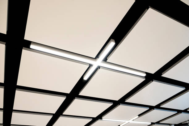 istock Metal Grid Background. Abstract Religious Cross Made from Lights In A Ceiling. 1286624100