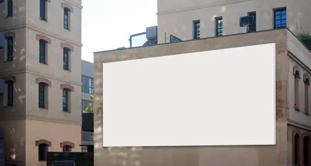 Photo of Blank billboard on the wall of building