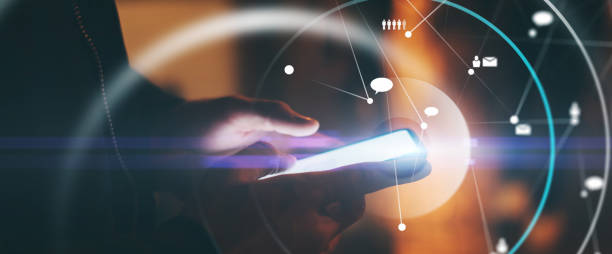 istock Concept of networking or remote work. Global business or social network. Young man typing on mobile phone on a street. Male hands with smartphone. 1286624468