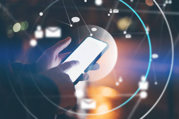 istock Concept of networking or remote work. Global business or social network. Young man typing on mobile phone on a street. Male hands with smartphone. 1286624474