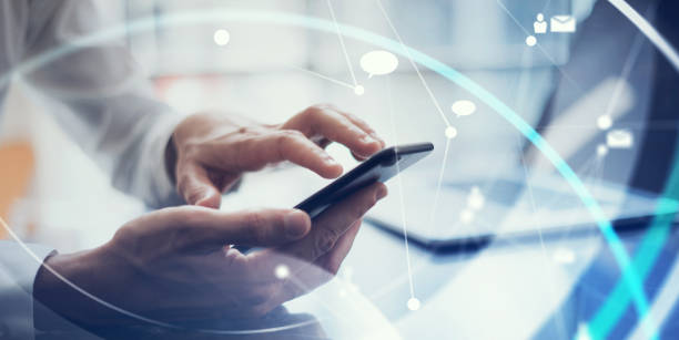 istock Businessman working remotely. Concept of networking or remote work. Global business network. Male hands with smartphone 1286624485