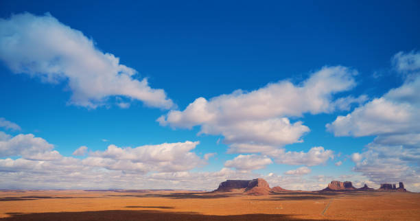 istock Panorama with puffy clouds on Monument Valley Arizona desert USA 1286627840