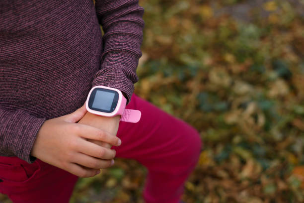 istock Pink children's smart watch. Protection and control. 1286628422