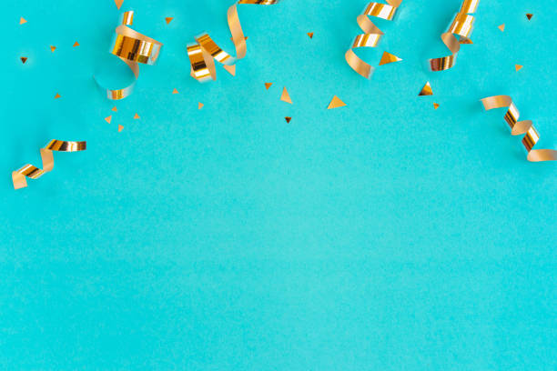 close up on group of gold color of rolling ribbon and confetti on teal background with copy space for christmas festival happy new year ,carnival , birthday and anniversary, concept design close up on group of gold color of rolling ribbon and confetti on teal background with copy space for christmas festival happy new year ,carnival , birthday and anniversary, concept design teal photos stock pictures, royalty-free photos & images