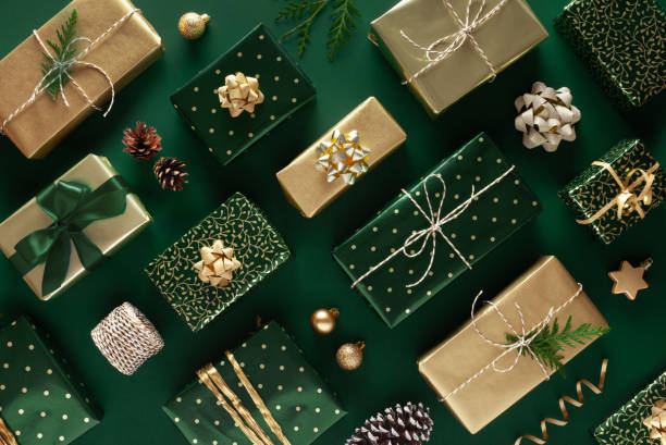 istock Christmas pattern. Gifts in wrapping paper on green background. 1286631524