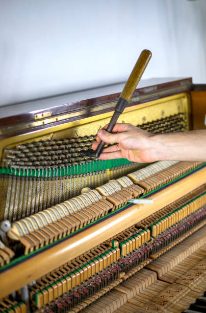 istock piano tune, key press, piano tune, tuner, musical., vertical, 1286631636