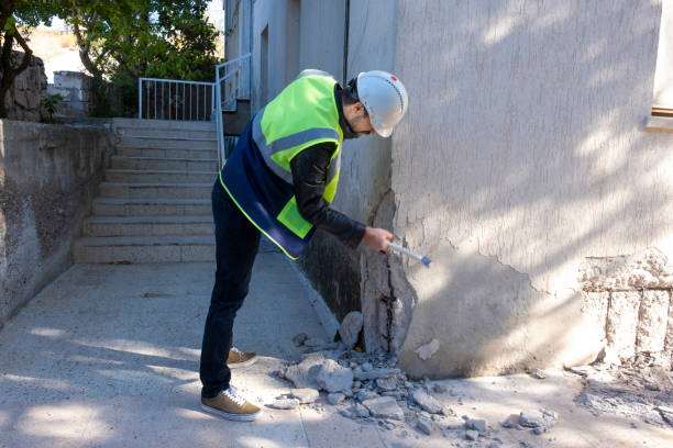 Young engineer checks the building after the earthquake stock photo