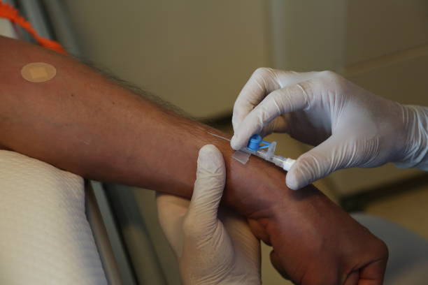istock Nurse's hand taking a blood sample from the patient's vein before surgery. 1286640010