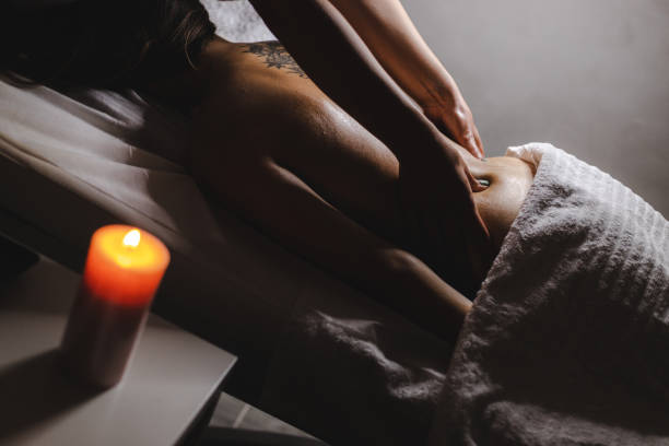 istock Young woman relaxing during back massage at the spa 1286641279