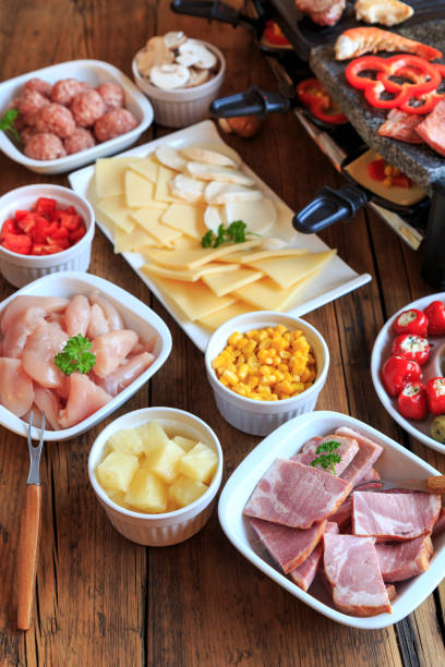 istock Raclette with vegetables, meat and cheese 1286647510