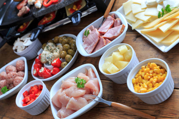 istock Raclette with vegetables, meat and cheese 1286648007