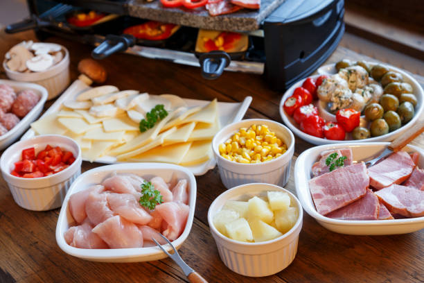 istock Raclette with vegetables, meat and cheese 1286648197