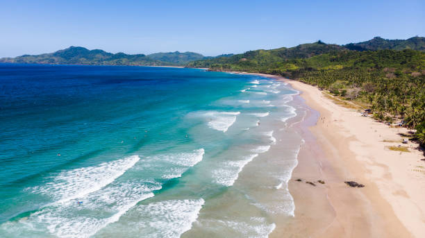 istock Surfing in Duli beach, El Nido, Palawan 1286648325