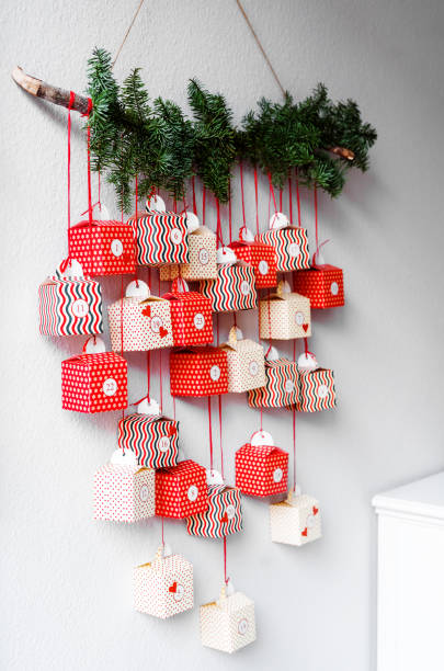 istock Handmade advent calendar gift boxes hanging on the wall. Sustainable Christmas,  zero waste, plastic free. 1286649741
